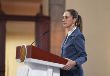 President Sheinbaum at her press conference podium