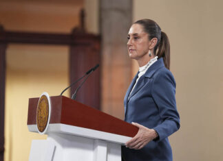 President Sheinbaum at her press conference podium