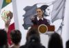 President Sheinbaum points to an audience of reporters at her morning press conference