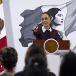 President Sheinbaum points to an audience of reporters at her morning press conference