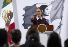 President Sheinbaum points to an audience of reporters at her morning press conference