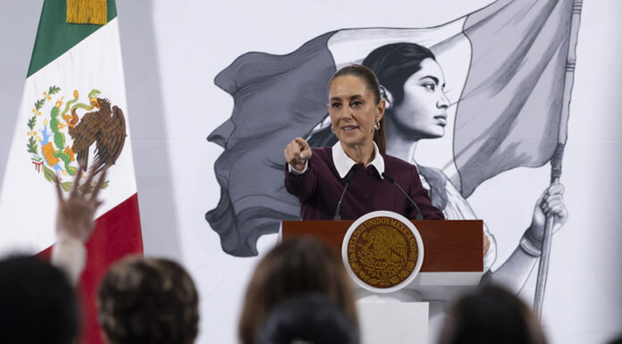 President Sheinbaum points to an audience of reporters at her morning press conference