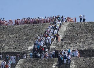 Climbers on the Pyramid of the Moon in Teotihuacan.