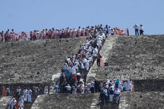 Climbers on the Pyramid of the Moon in Teotihuacan.