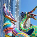 alebrijes set against San Francisco high rises.
