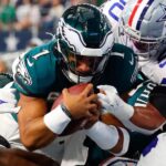 NFL players in a chaotic pile up.