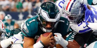 NFL players in a chaotic pile up.