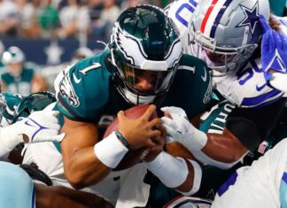 NFL players in a chaotic pile up.