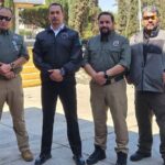 Victims Cesar Guzmán (R) and Carlos Amador (L) appeared in a photo last week with Jalisco Security Minister Juan Pablo Hernández (second to left)