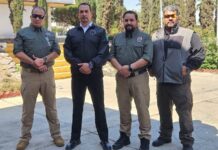 Victims Cesar Guzmán (R) and Carlos Amador (L) appeared in a photo last week with Jalisco Security Minister Juan Pablo Hernández (second to left)