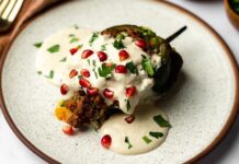 A chile en nogada served on a plate