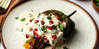 A chile en nogada served on a plate