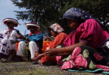 Indigenous people seated