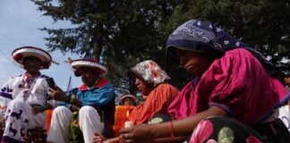 Indigenous people seated
