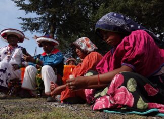 Indigenous people seated