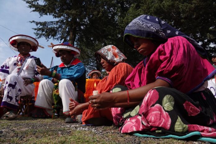Indigenous people seated