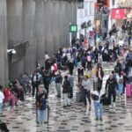 Crowds of travelers in the halls of Mexico City International Airport