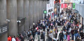 Crowds of travelers in the halls of Mexico City International Airport