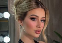 A blond influencer with doll-like makeup