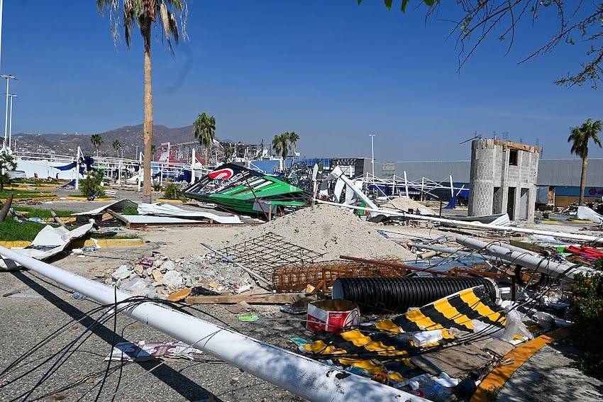 Acapulco after Hurricane Otis. There is wreckage of buildings and signs and other debris on the ground everywhere.