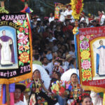 A street parade with colored banners