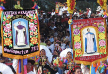 A street parade with colored banners