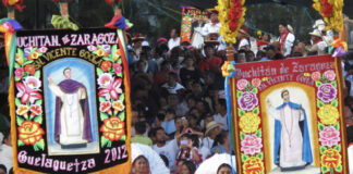A street parade with colored banners