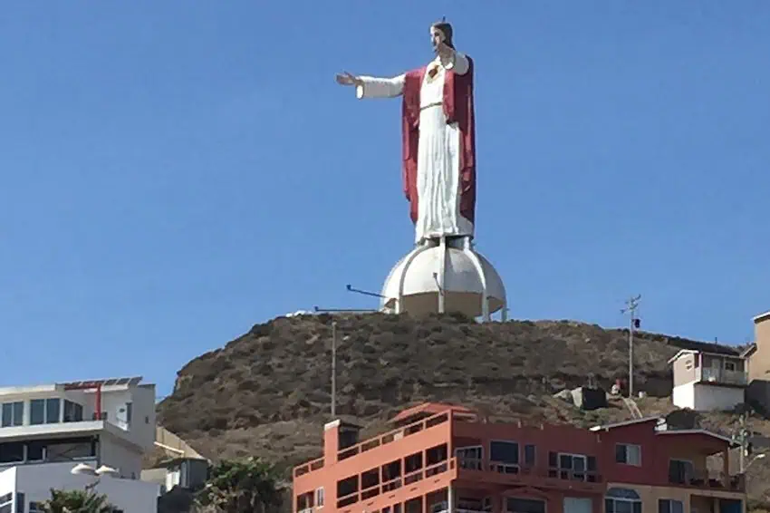 A statue of Jesus overlooks Rosarito beach, Baja California