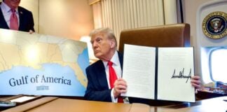President Trump displays a recently signed bill renaming the Gulf of Mexico