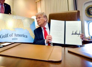 President Trump displays a recently signed bill renaming the Gulf of Mexico