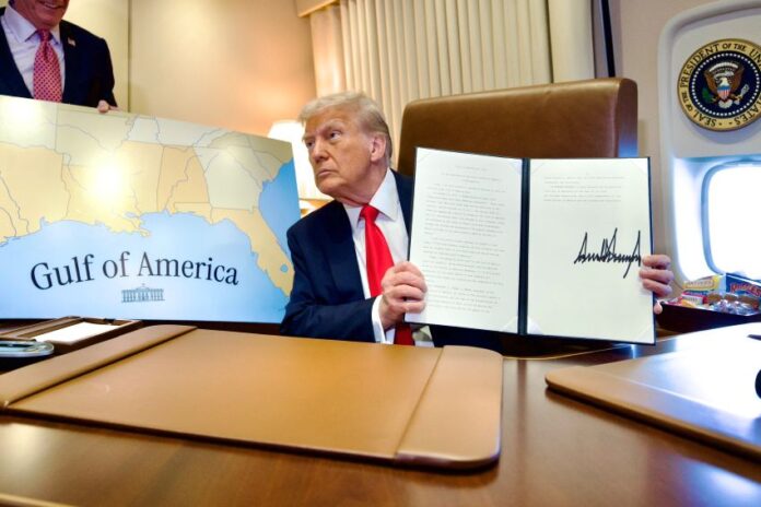 President Trump displays a recently signed bill renaming the Gulf of Mexico