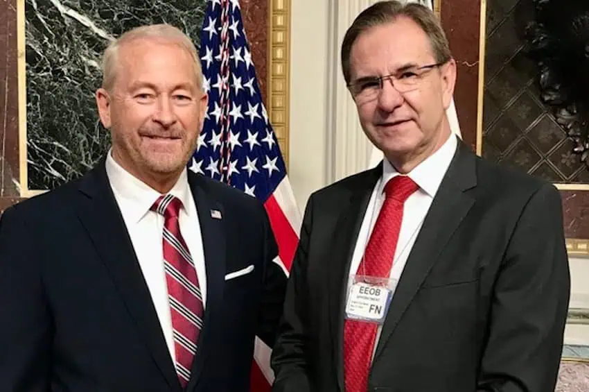 Two men in suits (Johnson and Moctezuma)
