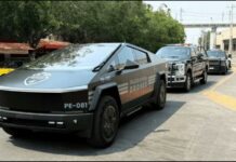 A parade of Jalisco security vehicles including a Tesla Cybertruck