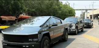 A parade of Jalisco security vehicles including a Tesla Cybertruck