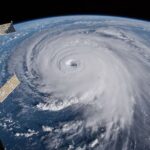 A hurricane with its eye on Earth, seen from outer space.