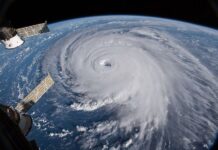 A hurricane with its eye on Earth, seen from outer space.