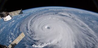 A hurricane with its eye on Earth, seen from outer space.