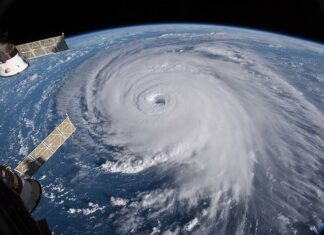 A hurricane with its eye on Earth, seen from outer space.