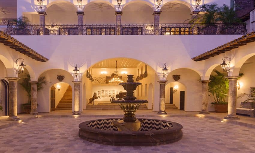A sumptuous Mexican Court of Adobe style on two floors with a tiled fountain in the center and Cantera Stone stops all around the perimeter of the courtyard.