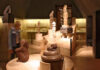 A museum room filled with sculptures and artifacts on display, all made by ancient Mexican indigenous cultures.