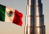 A Mexican flag flies in front of the Burj Al Arab in Dubai
