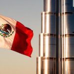 A Mexican flag flies in front of the Burj Al Arab in Dubai