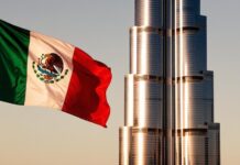 A Mexican flag flies in front of the Burj Al Arab in Dubai
