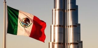 A Mexican flag flies in front of the Burj Al Arab in Dubai