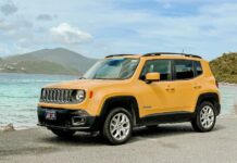 A yellow Jeep on a beach
