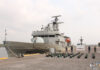 Mexican navy ship at dock with seized bricks of cocaine.