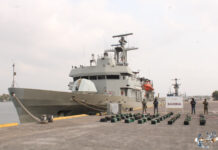 Mexican navy ship at dock with seized bricks of cocaine.