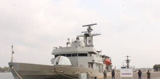 Mexican navy ship at dock with seized bricks of cocaine.