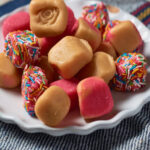 pieces of caramel-colored Mexican fudge, some tinted pink and some sprinkled with multicolored sprinkles