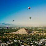Hot air balloons float over one of the Teotihucán pyramids in México state